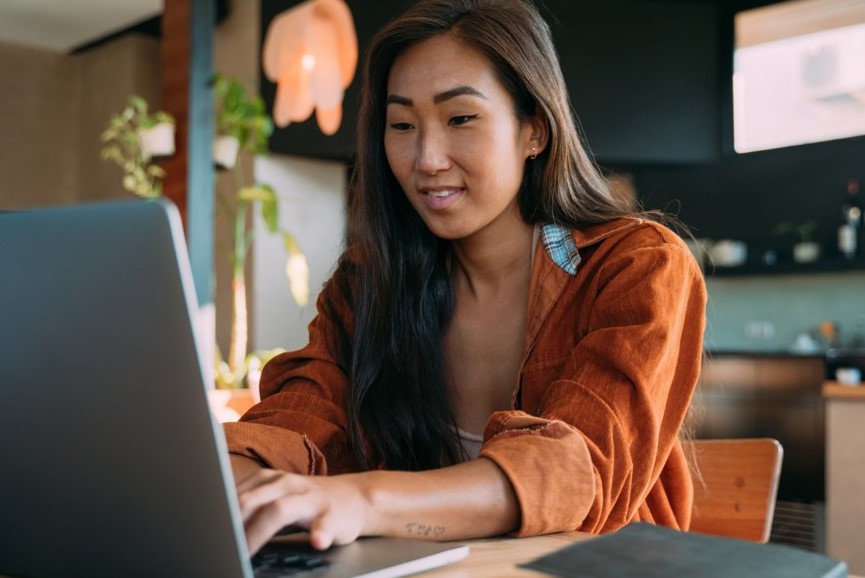 Woman typing on laptop